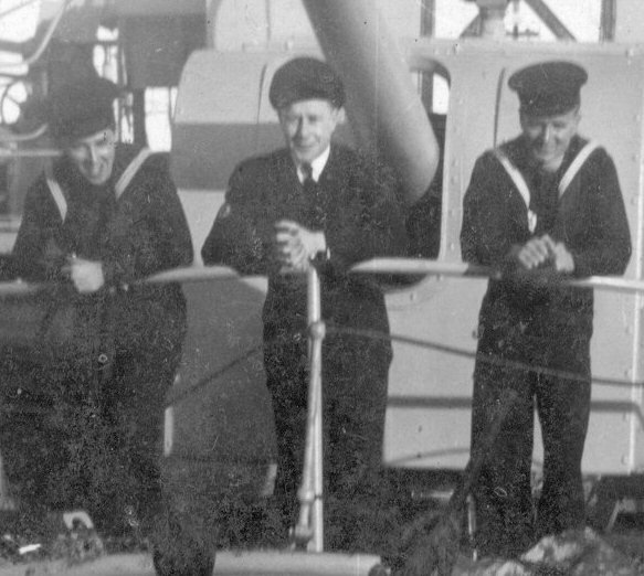 HMCS Kamloops three crew on bow close up