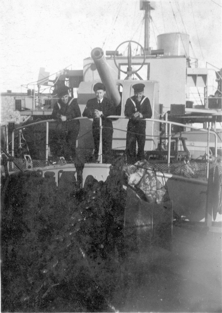 HMCS Kamloops three crew on bow