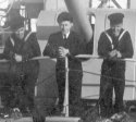 HMCS Kamloops three crew on bow close up